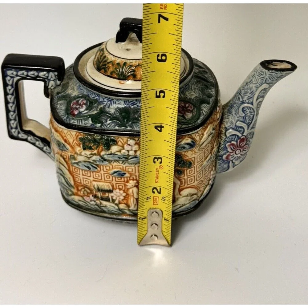 Teapot- vintage ceramic raised Asian  9 inches by 7 Inches